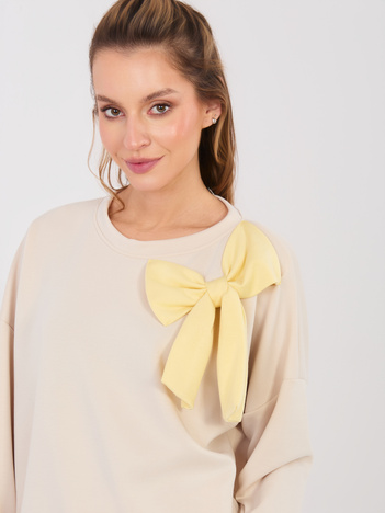 Jasnobeżowa damska bluza z kontrastową kokardą RUE PARIS