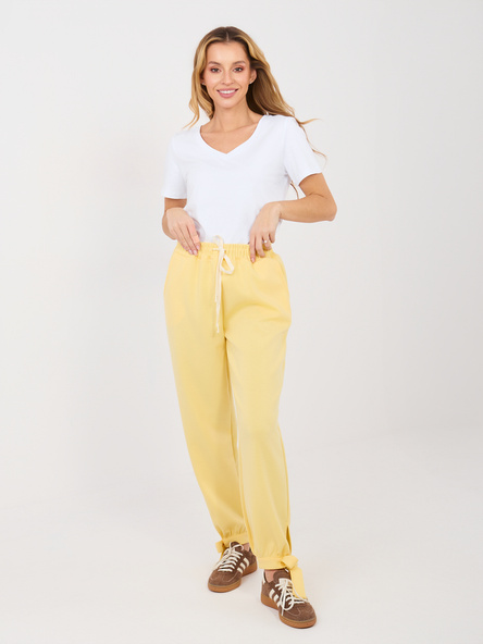 Jasnożółte dresowe spodnie z wiązanymi nogawkami