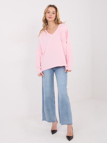 Jasnoróżowa bluzka z kwiatową aplikacją 3D