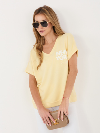 Jasnożółta damska bluzka z wypukłym napisem