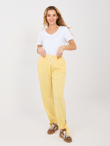 Jasnożółte dresowe spodnie z wiązanymi nogawkami