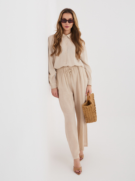 Beżowe zwiewne spodnie z wiązaniem