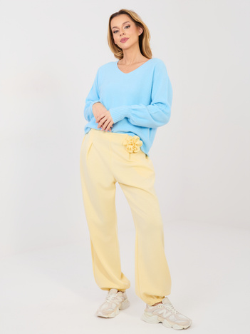 Pastelowe żółte dresowe spodnie bez zapięcia