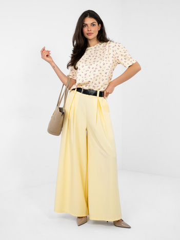 Pastelowe żółte szerokie spodnie z zakładkami RUE PARIS