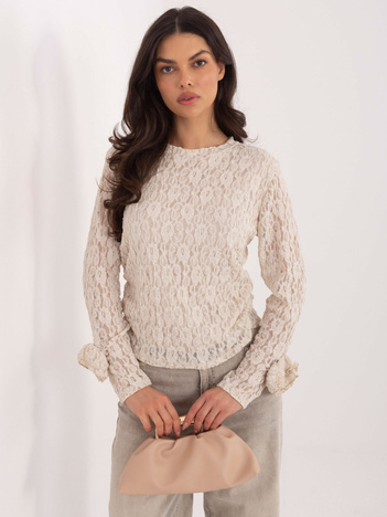 Jasnobeżowa damska bluzka z ozdobnymi różami