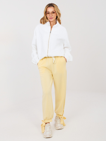 Jasnożółte spodnie z wiązanymi nogawkami