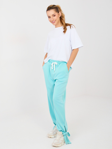 Miętowe dresowe spodnie ze ściągaczami