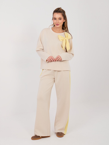 Jasnobeżowy komplet z kontrastową kokardą RUE PARIS