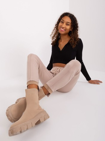 Jasnobeżowe spodnie dresowe z kieszeniami