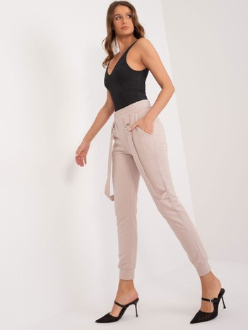 Beżowe spodnie dresowe ze ściągaczami