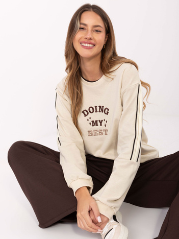 Jasnobeżowa bluza oversize z napisem