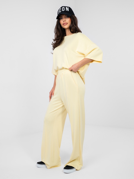 Pastelowe żółte spodnie basic z przeszyciami RUE PARIS