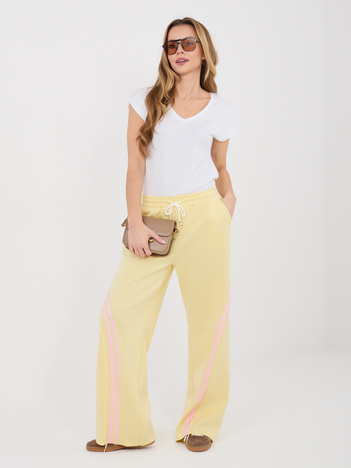 Pastelowe żółte dresowe spodnie z wiązaniem RUE PARIS