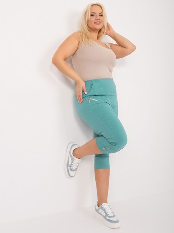 Miętowe dopasowane spodnie 3/4 plus size